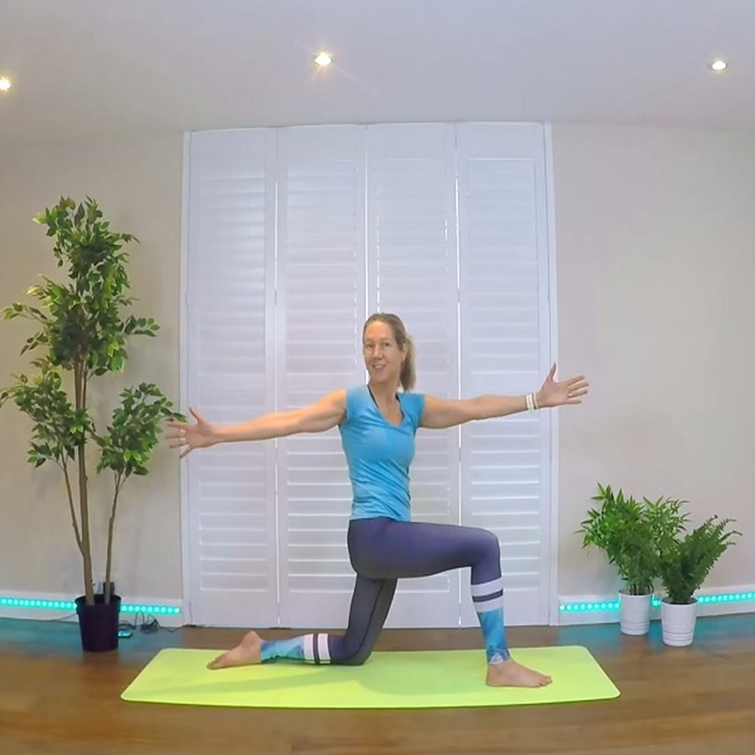 Shannon leading a yoga class on a mat