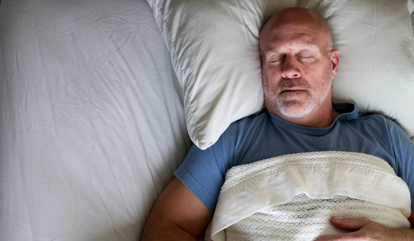 Man sleeping in bed