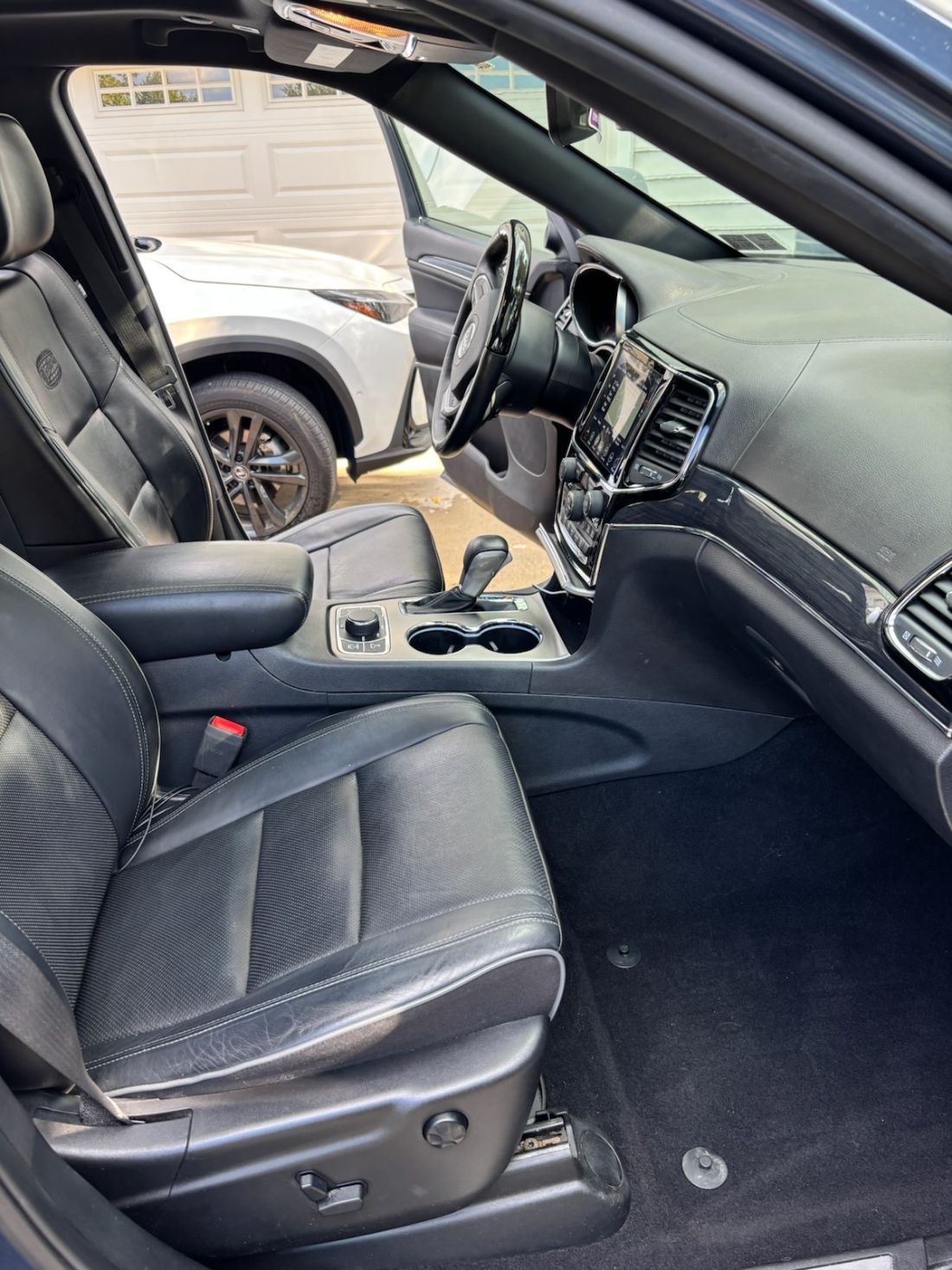 After slider of a Tesla interior professionally detailed by Gold Standard Mobile Detailing in Bala Cynwyd
