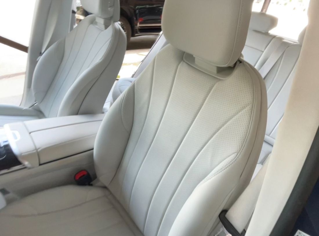 White leather car seats, with vertical stitching detail. client says this is the best  job shes ever had done to her car.