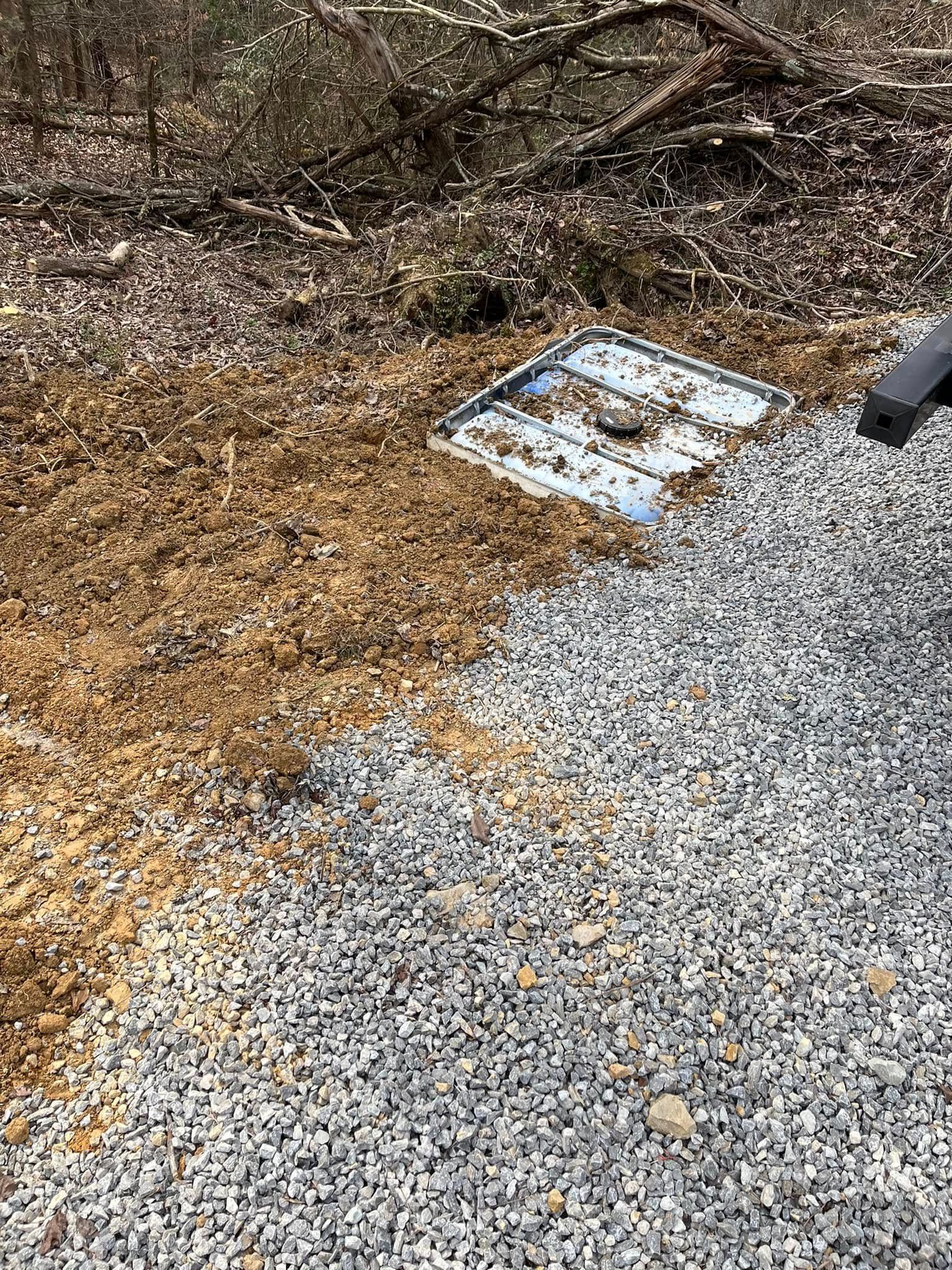 A person is using a shovel to dig a hole in the ground.