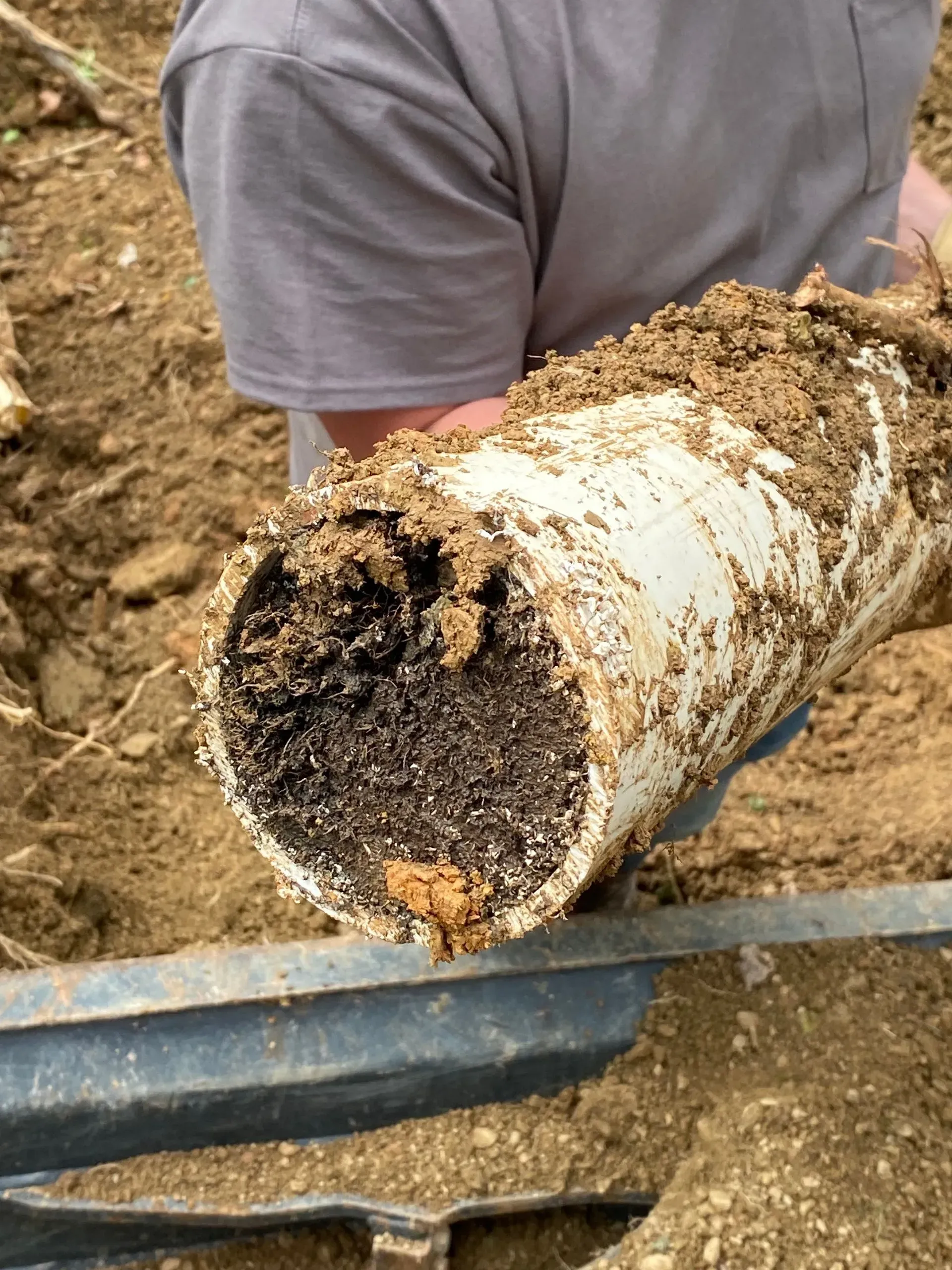 A large house with a garage and a driveway in front of it.