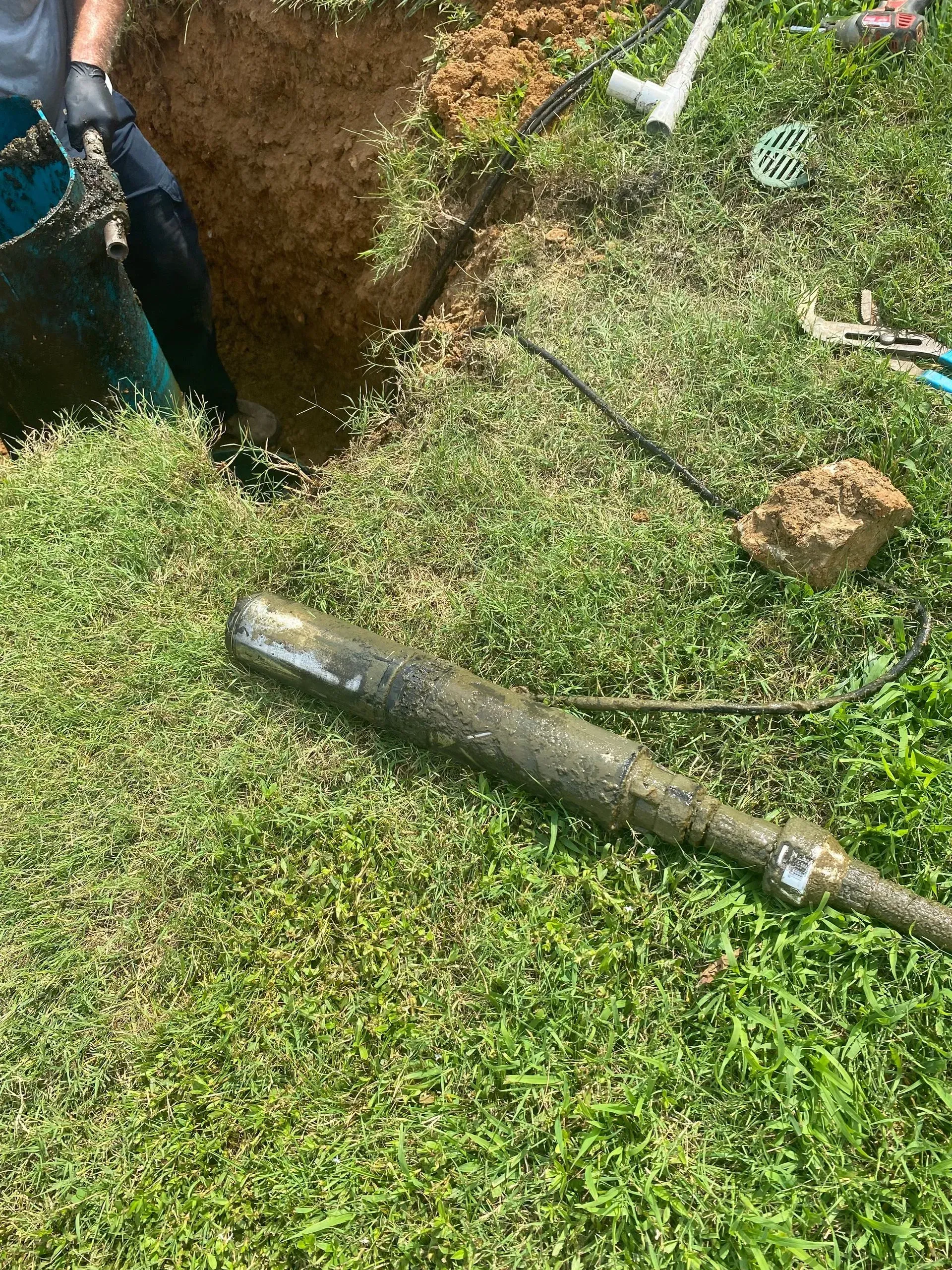 A large house with a garage and a driveway in front of it.