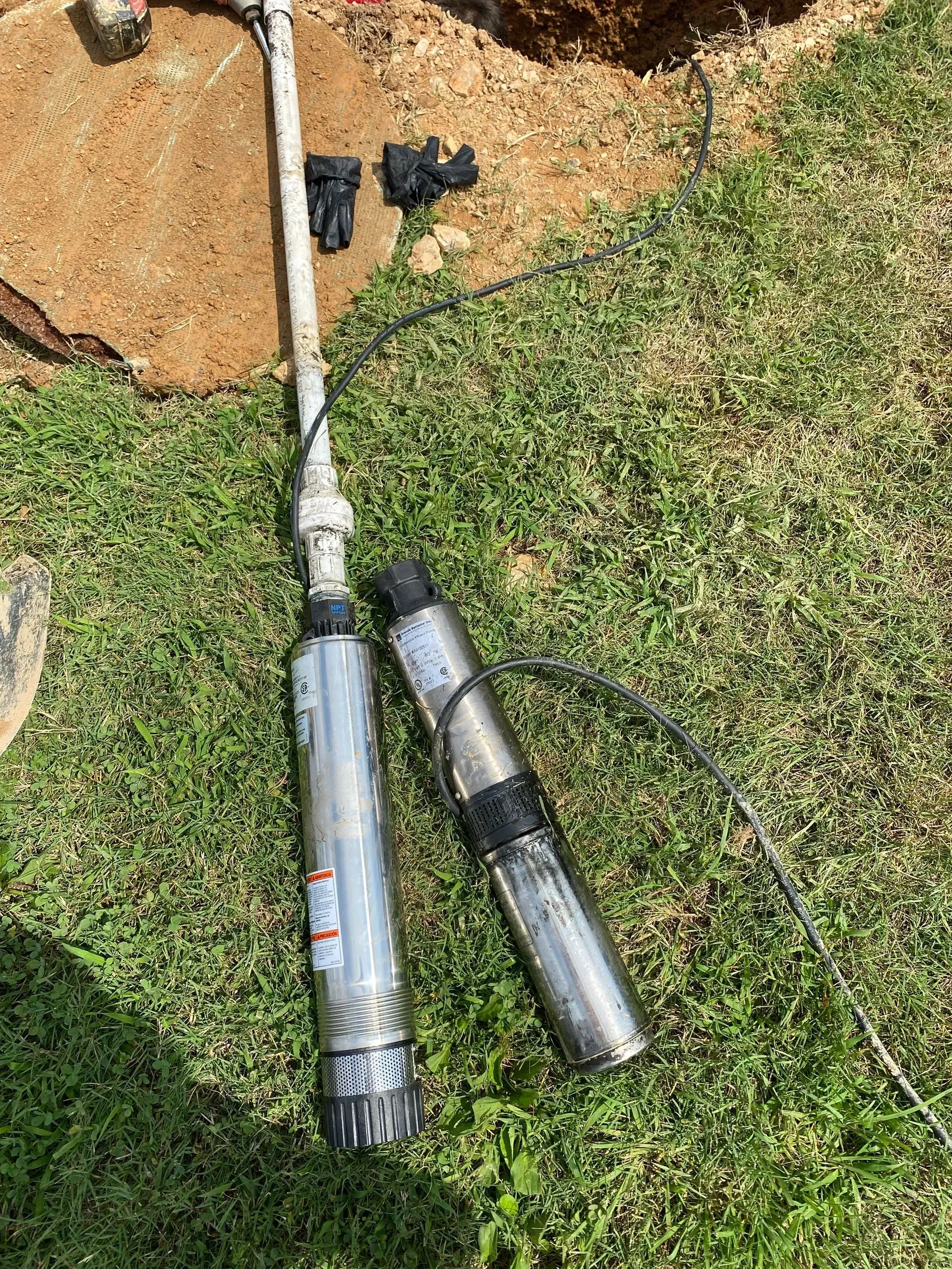 A large house with a lot of windows and a garage on a rainy day.