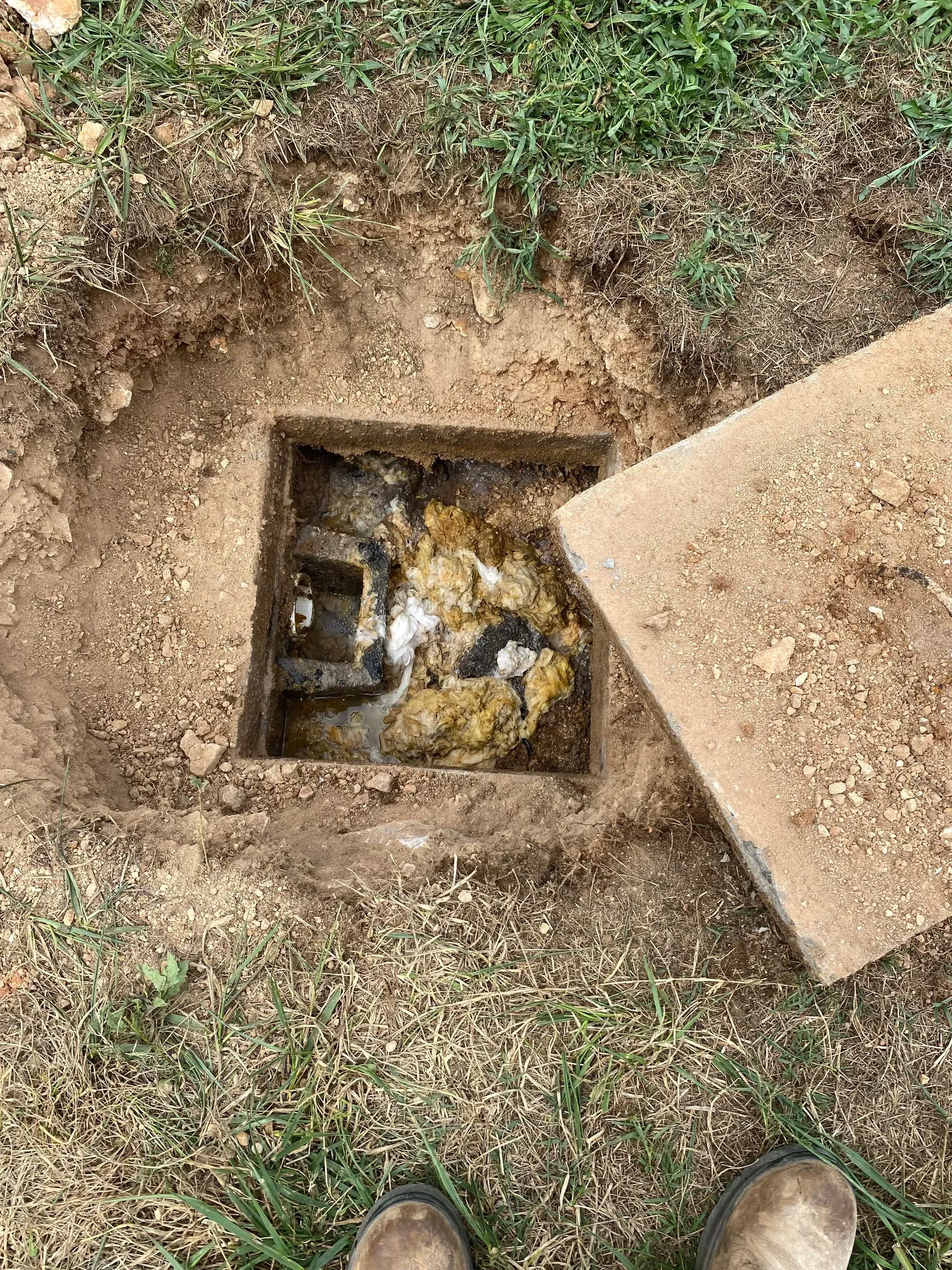 A large house with a garage and a driveway in front of it.
