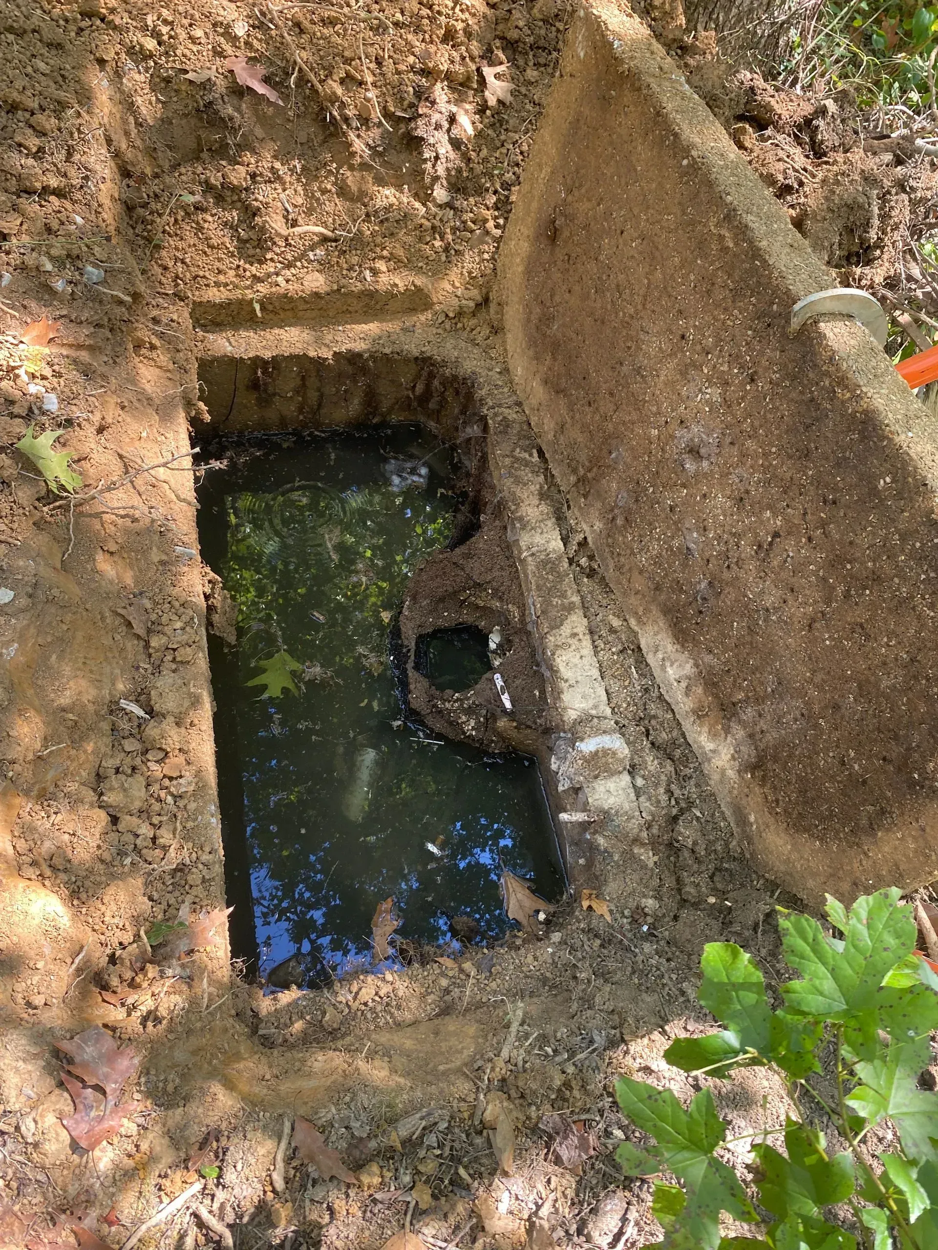 A large house with a lot of windows and a garage on a rainy day.
