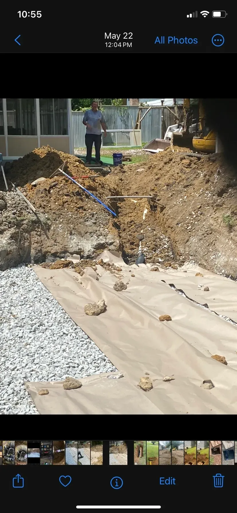 A large house with a garage and a driveway in front of it.