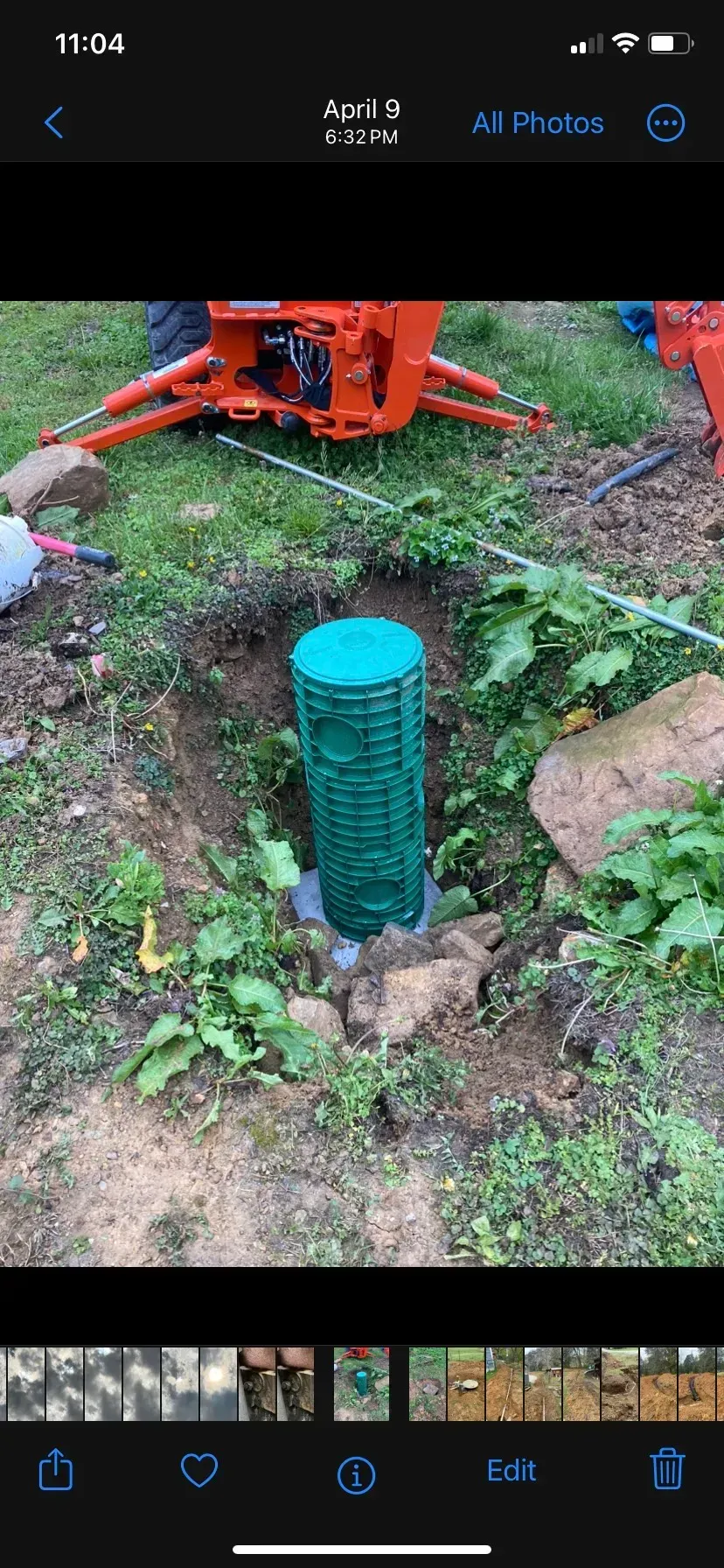 A large house with a lot of windows and a garage on a rainy day.