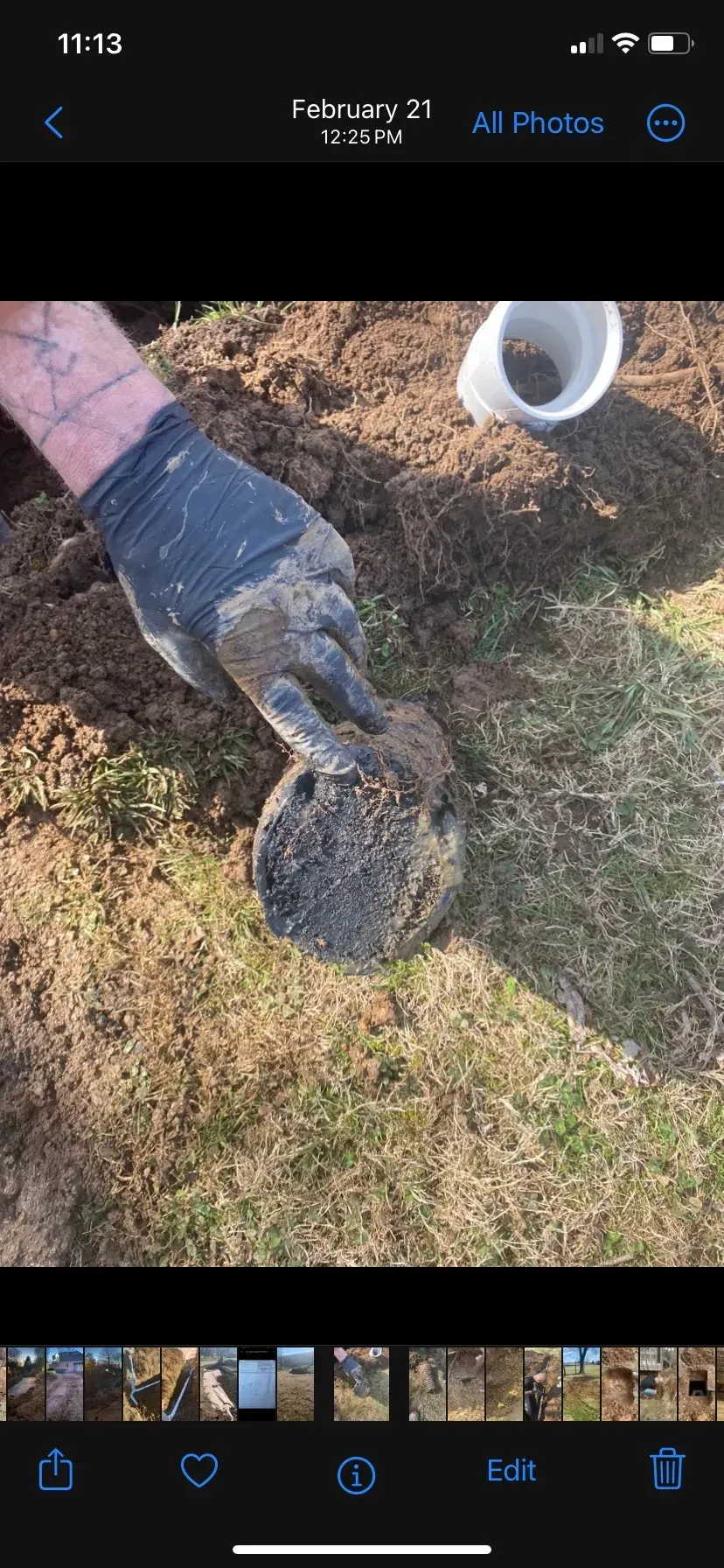 A large house with a lot of windows and a garage on a rainy day.
