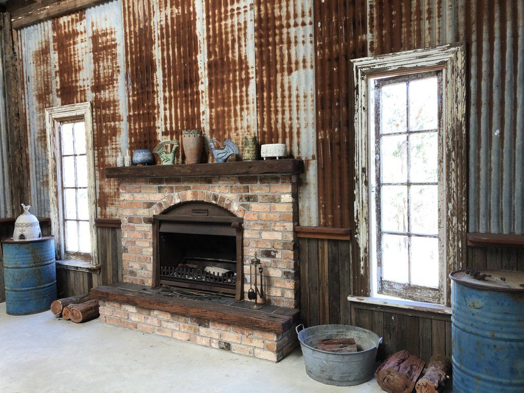 There is a fireplace in the middle of the room.