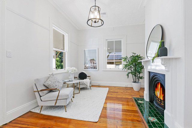 A living room with a fireplace and a couch.
