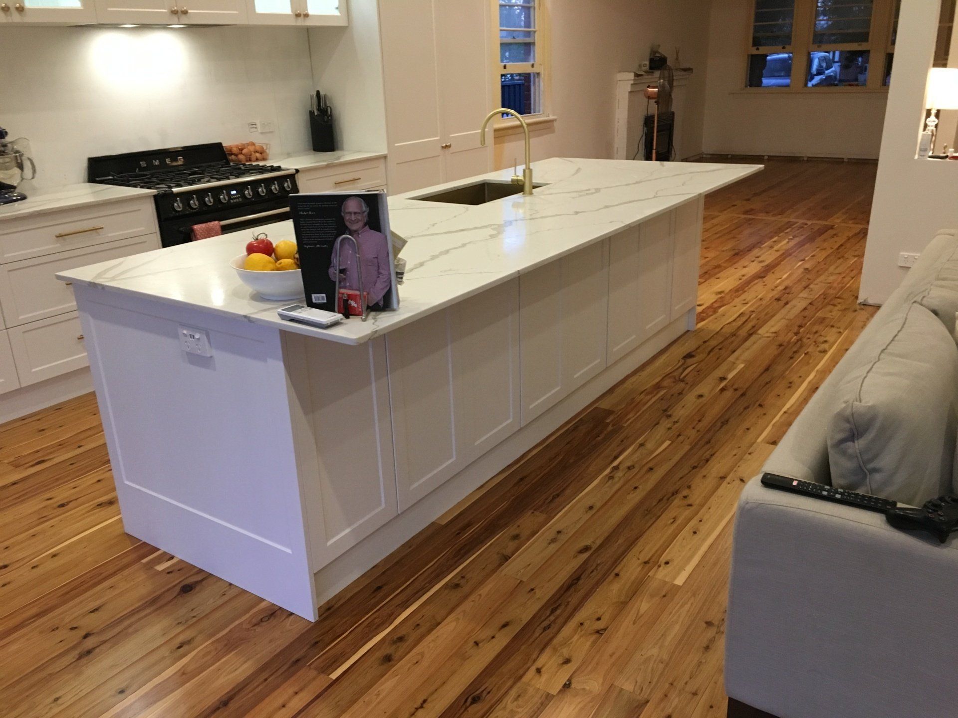 There is a large island in the middle of the kitchen.