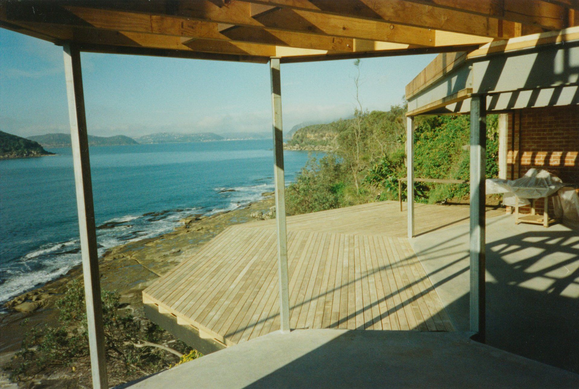 A wooden deck overlooking a body of water