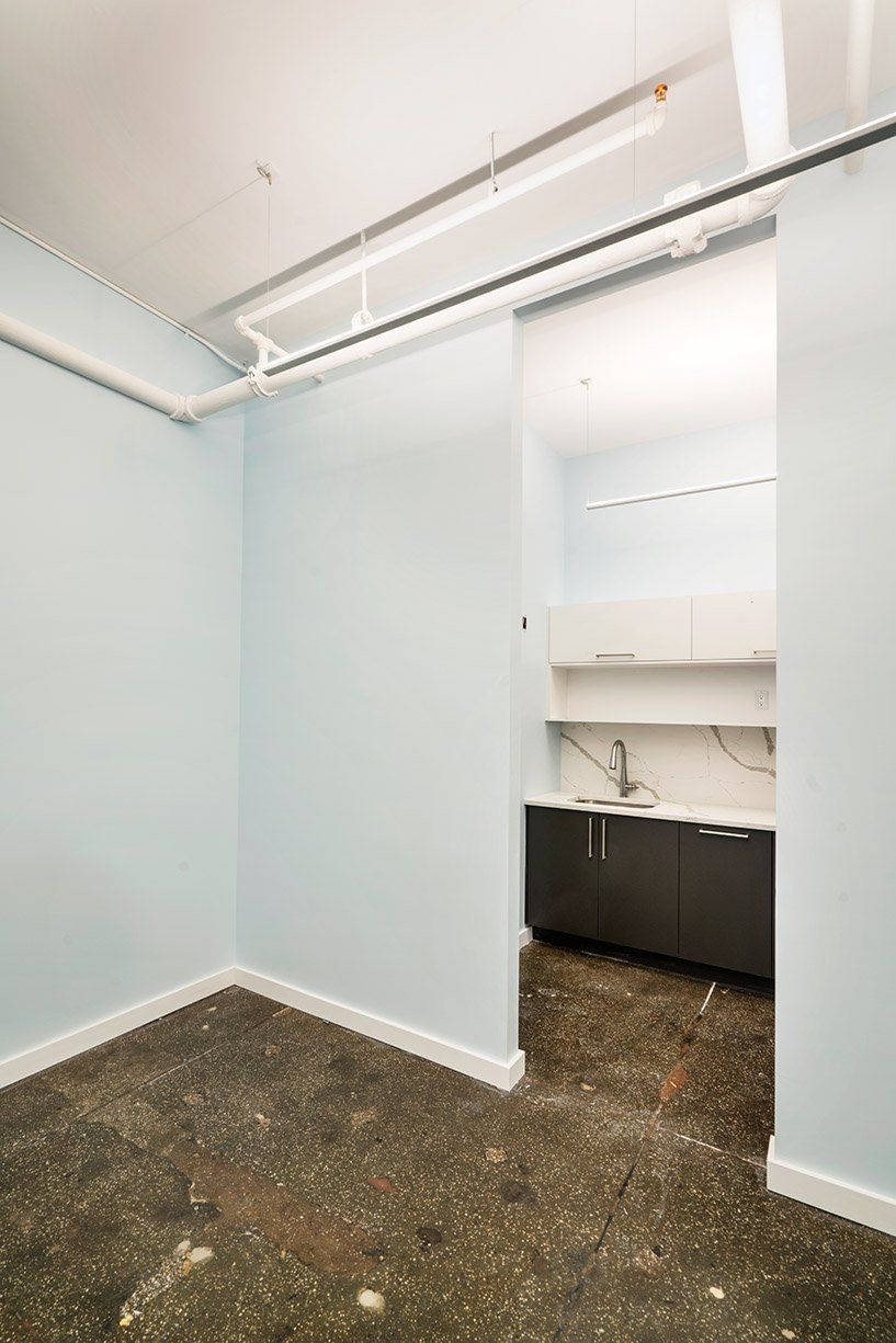 Commercial Space with Bare Ceiling and Air Conditioner Pipe — Brooklyn, NY — Hub Home Improvements