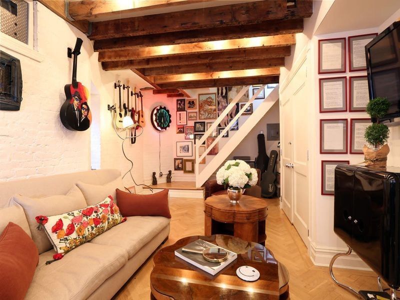 Guitars Hanging on Living Room Wall — Brooklyn, NY — Hub Home Improvements