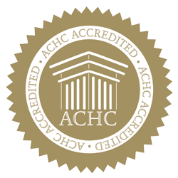 A seal that says achc accredited on it