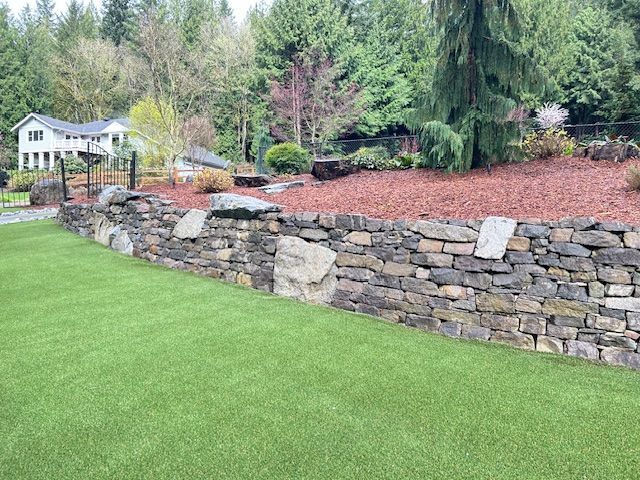 A large house with a lush green lawn in front of it.