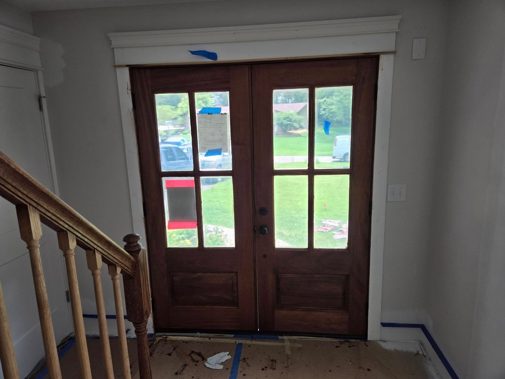 A wooden door with a staircase leading up to it