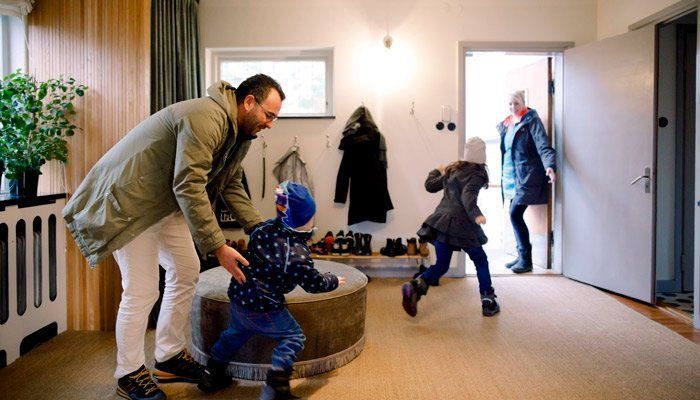 happy family leaving home in winter