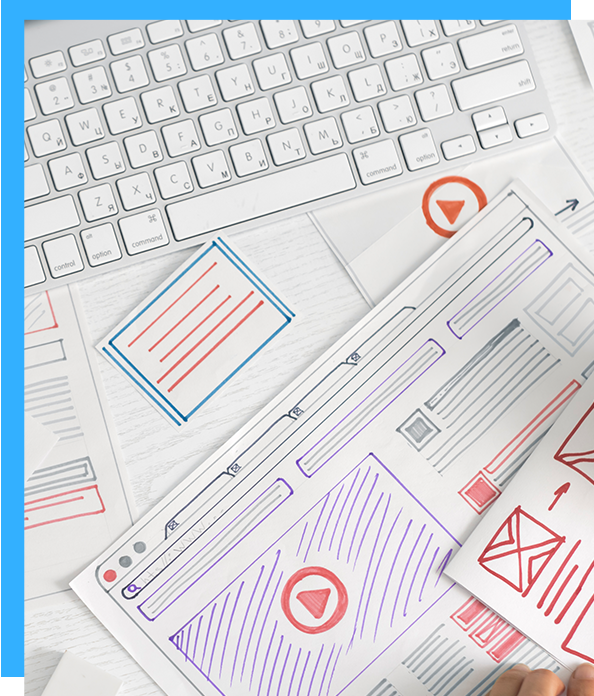 Web design sketches with keyboard, featuring hand-drawn layouts and icons.