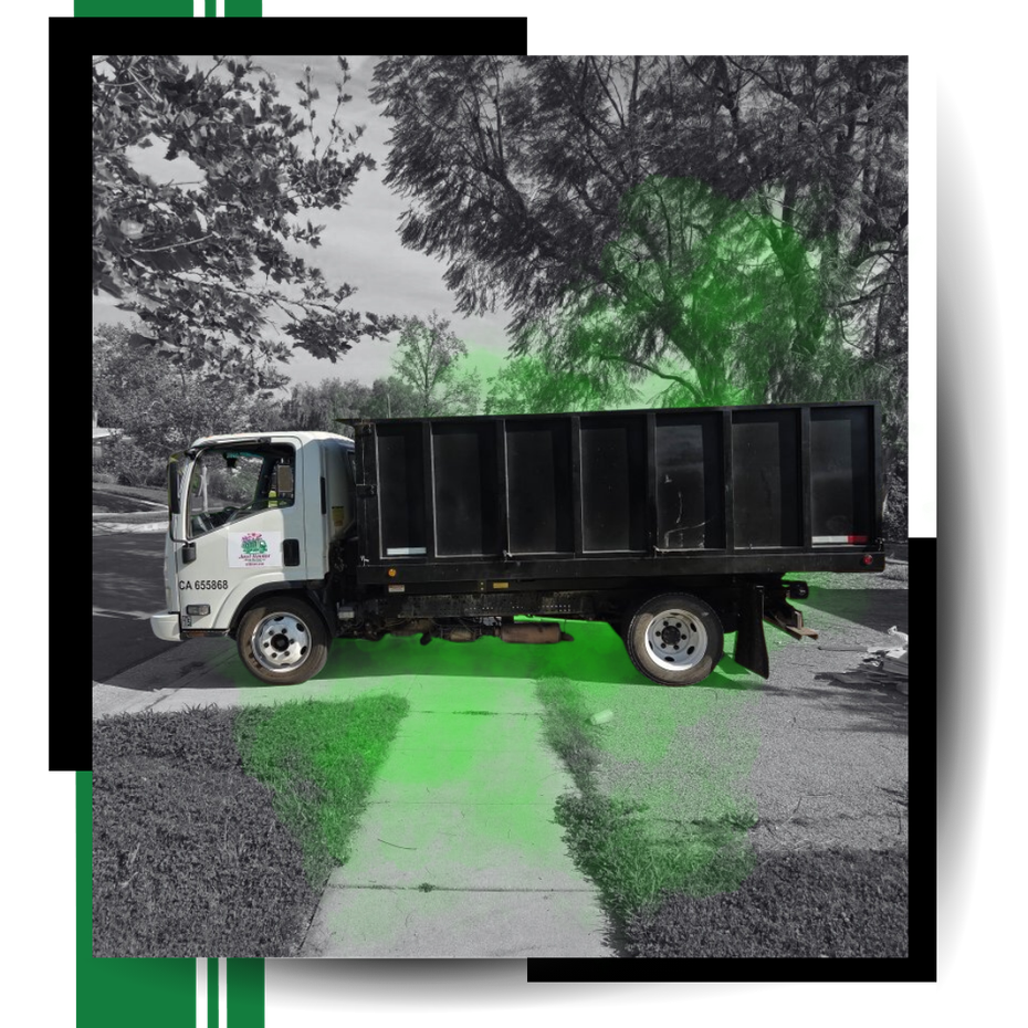 Junk Hauler Junk Removal truck parked on the road with graphics around it