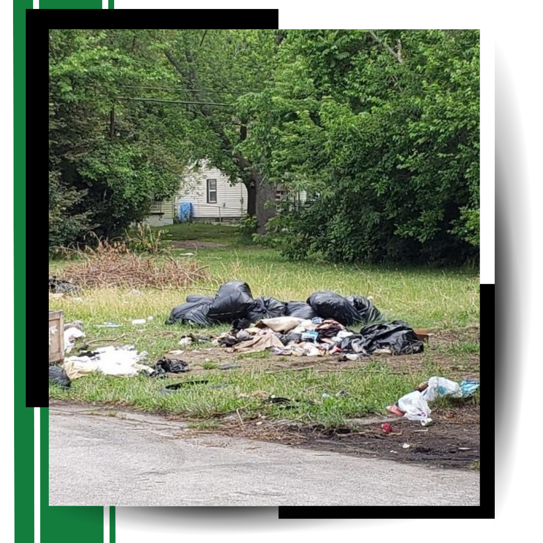 A pile of garbage thrown in the backyard with graphics around it.