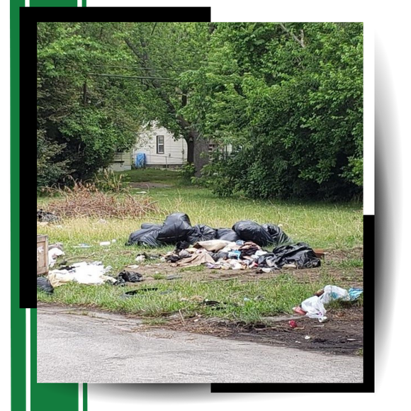 A pile of garbage thrown in the backyard with graphics around it.