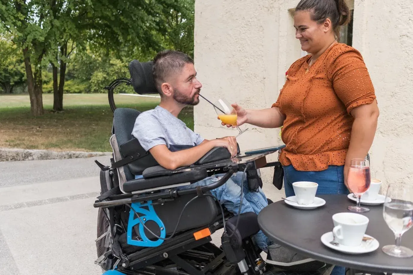 Doctors practicing medical procedures on a dummy arm, preparing for injections.
