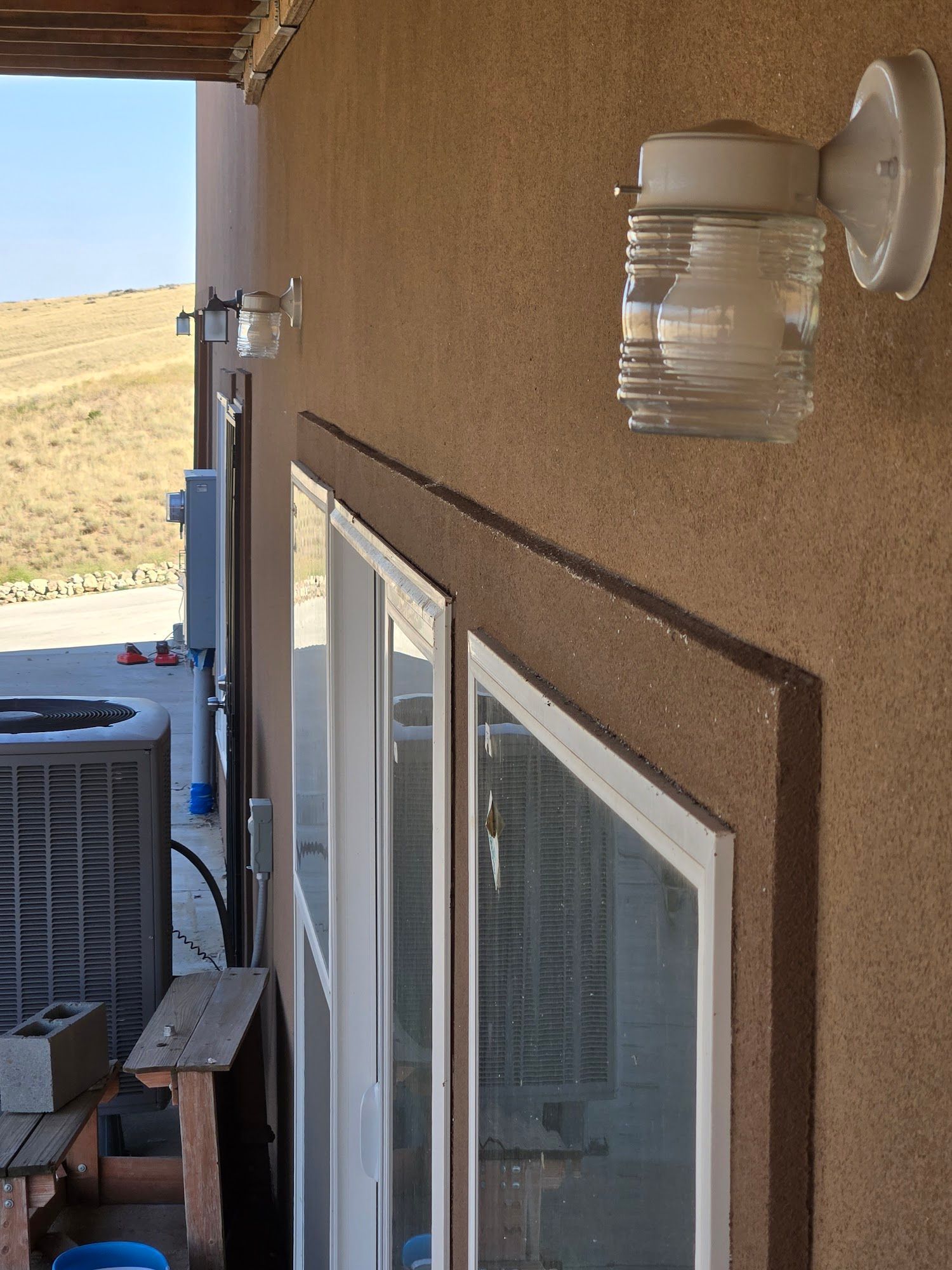 A sliding glass door with a light on the side of it