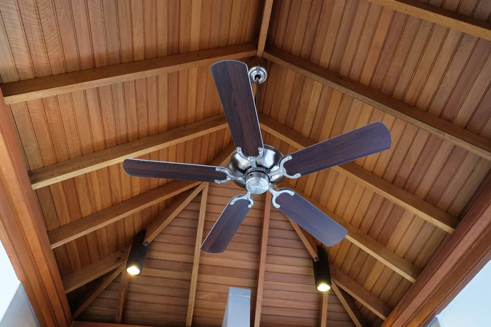 Three lamps are hanging from the ceiling in a room