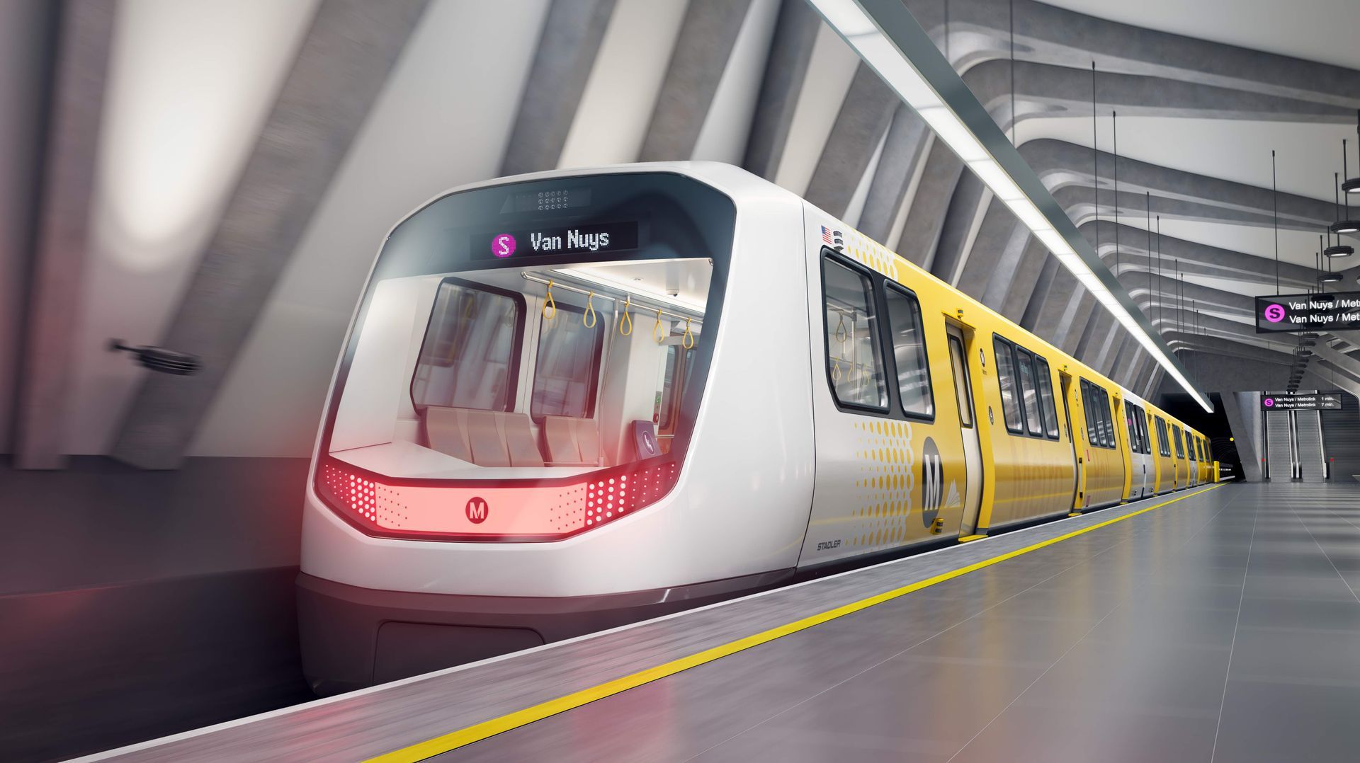 A yellow and white train is sitting at a train station.