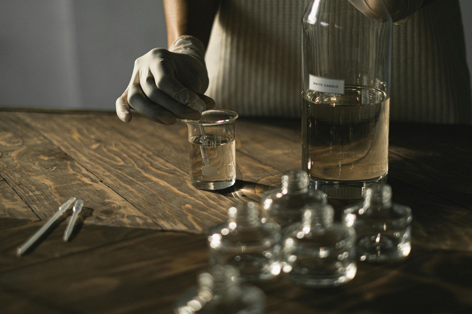 High-quality liquid natural flavor extract being precisely measured in a state-of-the-art laboratory