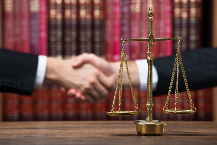 handshake between lawyer and client