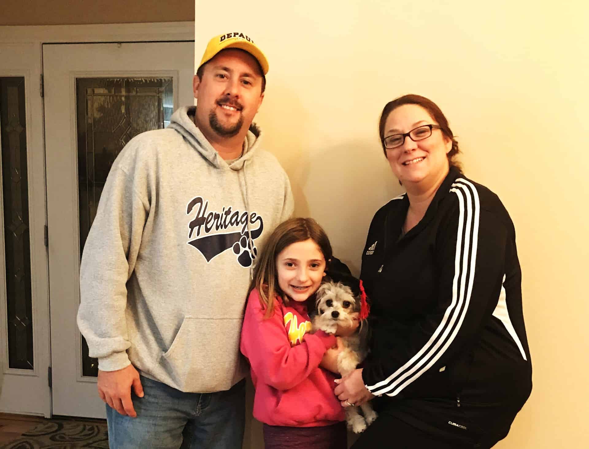 Cute Puppy And Family — Saint Charles, MO — Positive Paws Pet Training Inc.