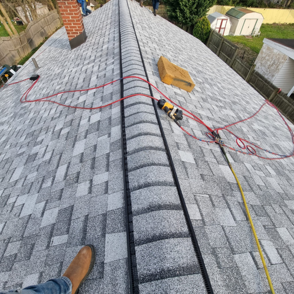 A Person Is Standing on The Roof of A House - New Castle, DE - Macedo Mexpro LLC