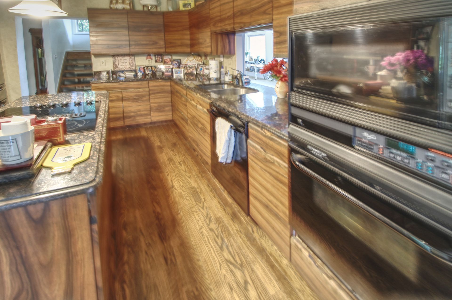 A kitchen with wooden cabinets and stainless steel appliances