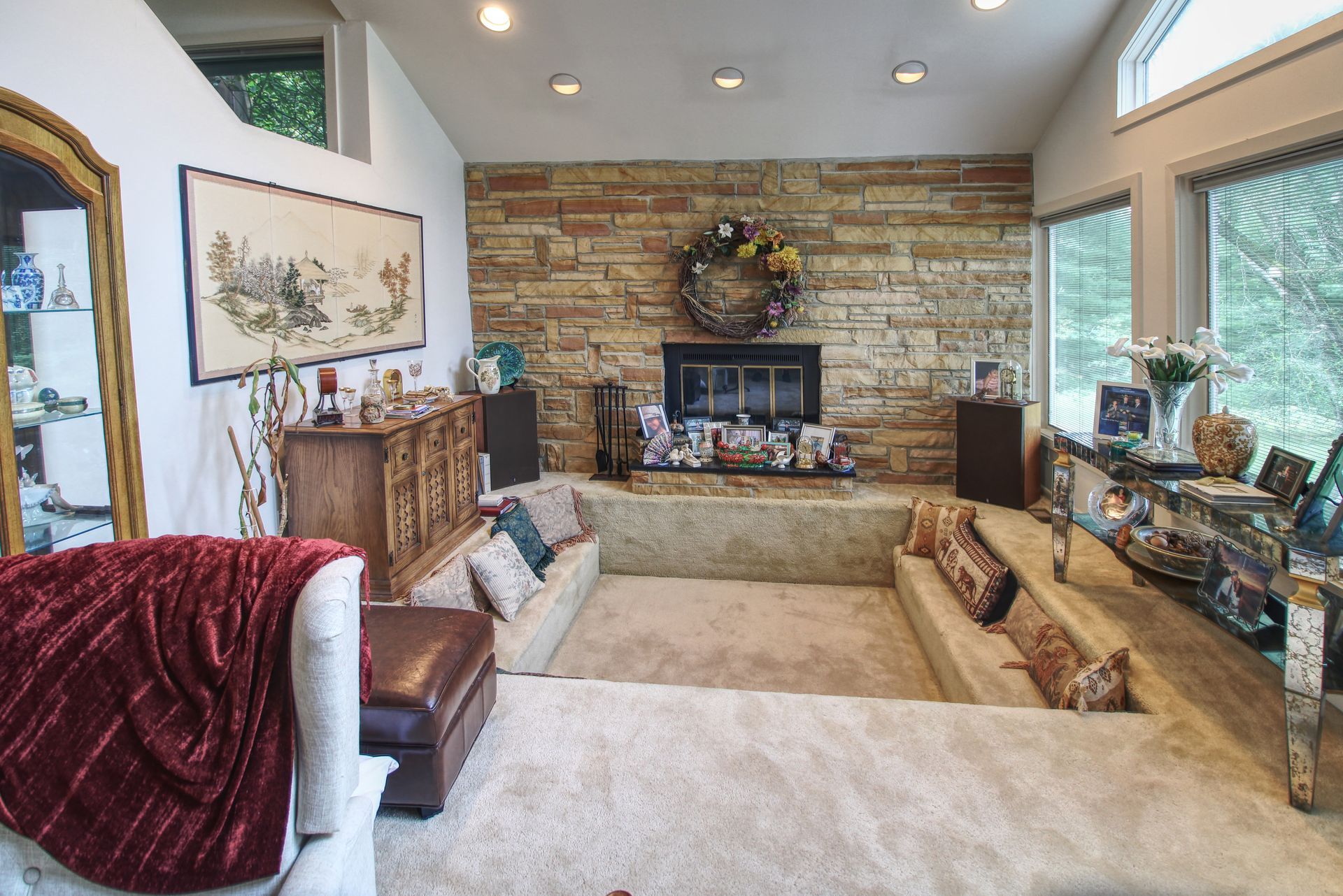 A living room filled with furniture and a fireplace.