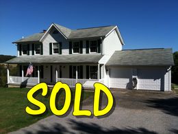 A picture of a house that has been sold