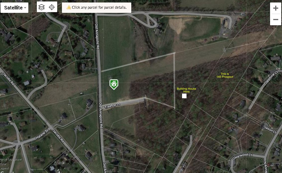 An aerial view of a field with a shield on it.