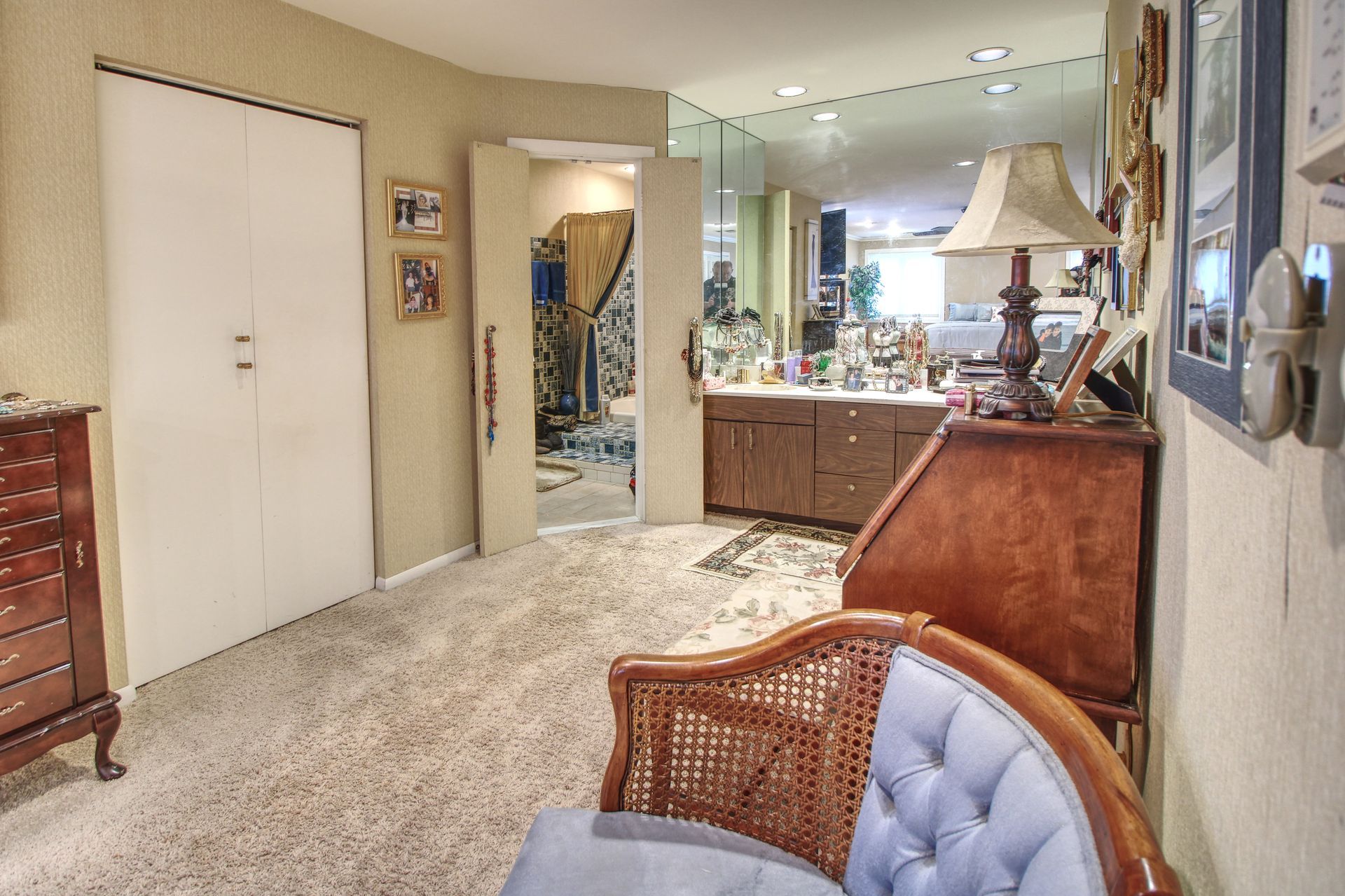 A living room with a chair and a dresser