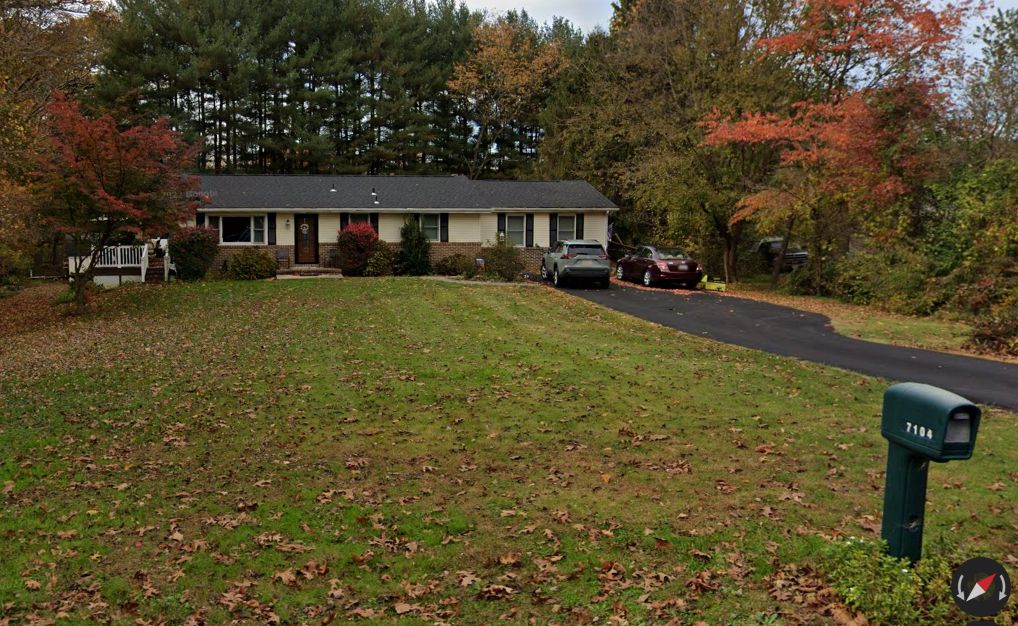 A house with a mailbox in front of it
