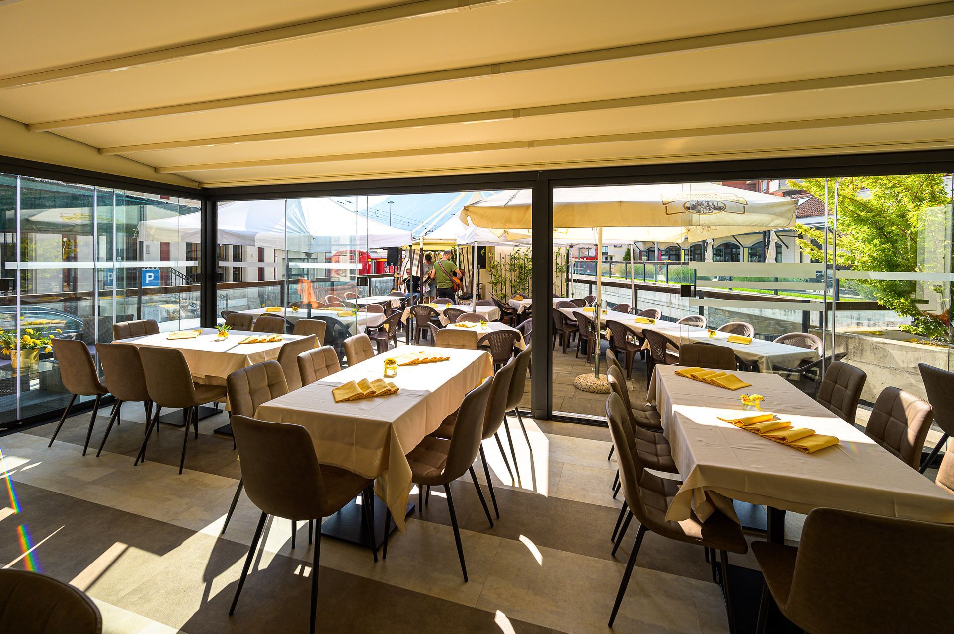 There are many tables and chairs in the restaurant.