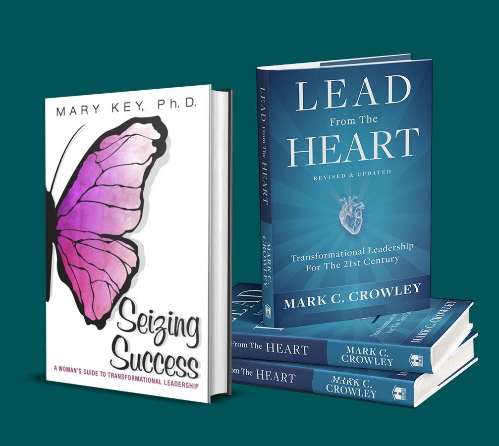 A stack of books titled lead the heart and seizing success