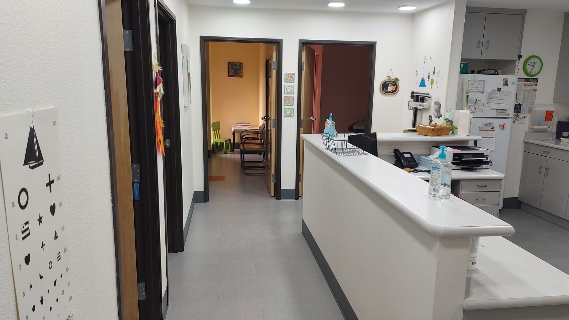A long hallway with a counter in the middle of it
