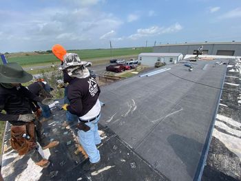 roofer standing on roof