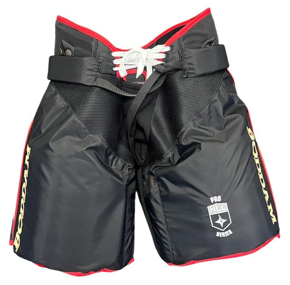 A pair of black shorts with a white logo on the side