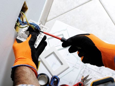 Electrician Repairing House Outlet — Residential in Withcott, QLD