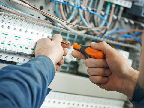 Electrician Fixing Fuse Box — Commercial & Industrial in Withcott, QLD