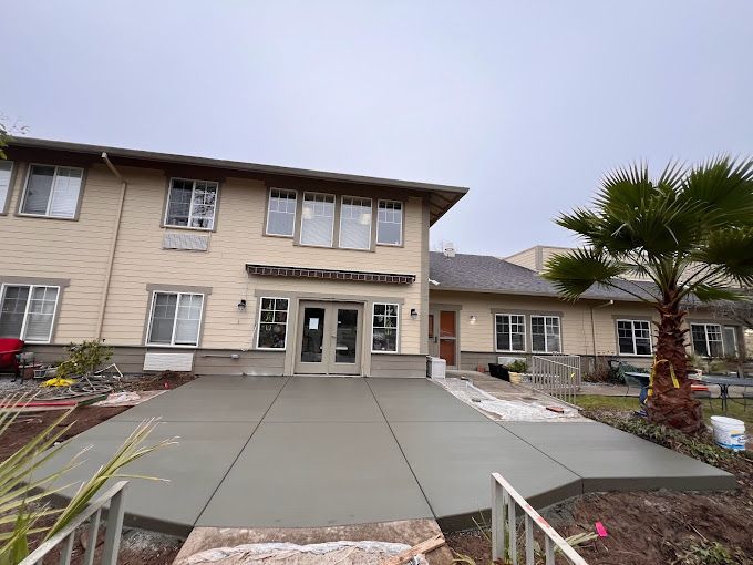 A large building with a concrete walkway leading to it