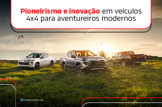 Carros Mitsubishi estacionados em um campo gramado.